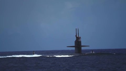 CIRCA 2020 - Los Angeles class fast attack submarines and navy crew transit Apra Harbor, Naval Base Guam.
