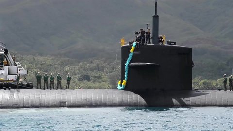 CIRCA 2020 - Los Angeles class fast attack submarines and navy crew transit Apra Harbor, Naval Base Guam.