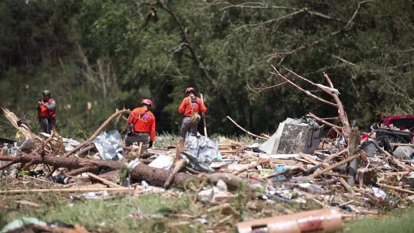 CIRCA 2020 - U.S. Marines and contractors clear debris during the recovery effort from Hurricane Isaias, Camp Lejeune, North Carolina.