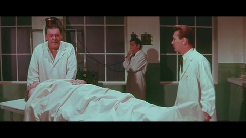 CIRCA 1967 - In this classic horror film, a doctor (Lon Chaney Jr.) brings a dead body back to life with the help of two med students.