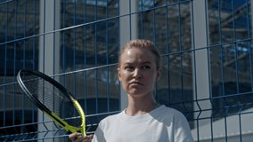 Portrait of professional beautiful sports experienced woman tennis player with a racket. female sport activity, motivational video, american player before game.
