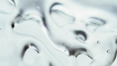 Liquid Gel Cream With Micro Bubbles Moving In Glass. - macro shot