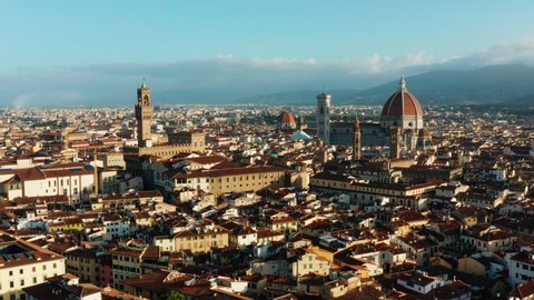 Wide aerial pan over Florence, Italy. Sunrise over city