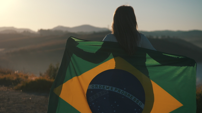 Proud girl of her country with flag of Brazil	 | Shutterstock HD Video #1058393572
