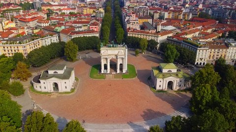 Gate Sempione Porta Sempione city gate to Lombardy in the fall. Arch of Peace. Arco della pace. sunny evening in milan city park aerial panorama 4k italy milano city triumphal arch. Sculptures 