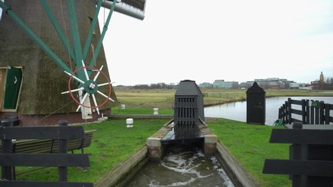 Windmill pumping water from below sea-level polders into canals