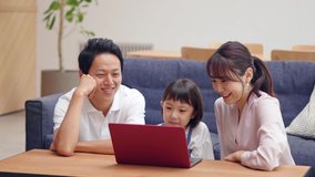 Family using a laptop pc in modern interior. Lifestyle concept.