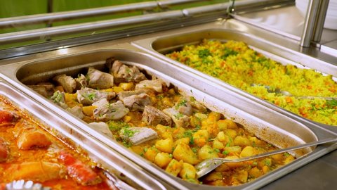 close-up. display showcase with freshly prepared meals in self-service cafeteria or buffet restaurant. health food. volunteering and charity. reopening . safety concept