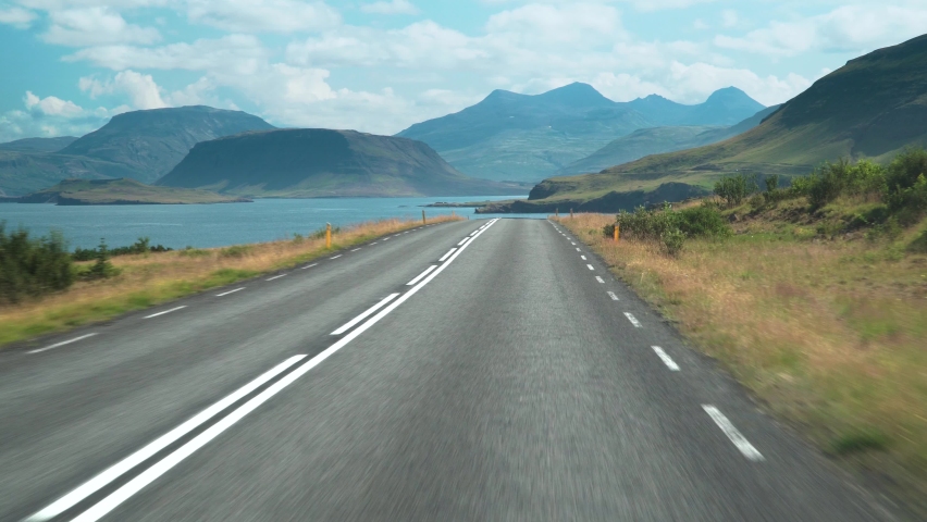 Beautiful nature of Iceland. Car driving on the road to Iceland. Inside view of a car. Road number 1 is Iceland's main road. 4K | Shutterstock HD Video #1058410006