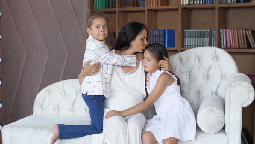 Mother and her children on sofa