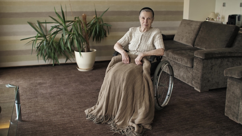 Grandmother on a wheelchair in the room