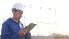 power electrical worker engineer in helmet a working with digital tablet, near tower with electricity. business energy technology industry concept. electrical studying reading documents on tablet - Powered by Shutterstock - Get 15% off with code: PIKWIZARD15