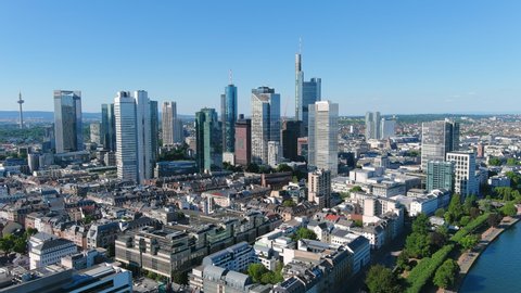 Aerial view of city skyline of Frankfurt am Main, cityscape with modern buildings (skyscrapers) with clear blue sky behind them - landscape panorama of Germany from above, Europe