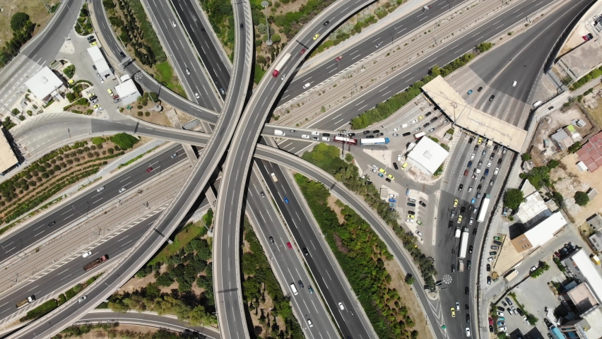 Aerial view of Athens largest highway intersection between Greek national highway and Attiki Odos motorway. Attica region, Greece.