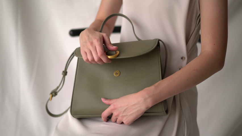 hand open a fashion leather bag Royalty-Free Stock Footage #1058427943