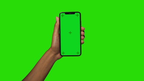 New York, New York/United States - August 31 2020: Holding Apple iPhone 11 Xs Max Pro Smartphone in Black female hands with green screen trackers on the dispaly.