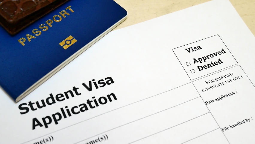Decision to grant a visa. Pen voting approved in checkbox in blank Student Visa application form with passport and pen. Document with passport, apply and permission for foreigner country Royalty-Free Stock Footage #1058455915