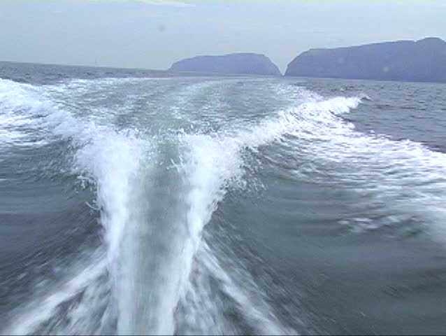 BOAT WAKE. The Channel Islands, California can be seen in the background.