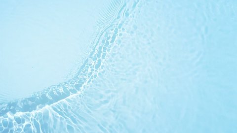 Beautiful Water Surface Flowing in slow motion. Clear Blue Water Caustic Background, Top view of Water on white background. Refraction of sunlight top view water texture 