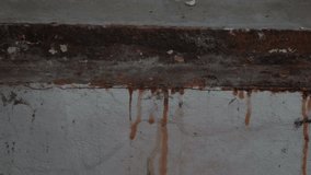 Grinding old rust in a basement.
Close up video of scraping old rusty metal.