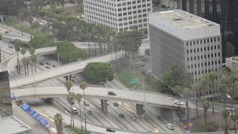 Overhead Shot Following Cars Moving Through Freeways in Downtown LA