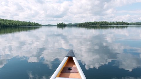 Glassy Lake Canoe POV With Sky Reflection