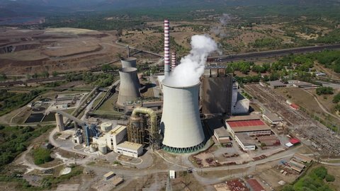 Aerial drone video of Hellenic public electric company industrial power plant complex in town of Megalopolis, Arcadia prefecture, Peloponnese, Greece