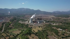 Aerial drone video of Hellenic public electric company industrial power plant complex in town of Megalopolis, Arcadia prefecture, Peloponnese, Greece