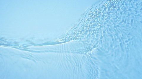 Water surface texture, Slow motion clean swimming pool ripples and wave, Refraction of sunlight top view texture sea side white sand, sun shine water  background. Water Caustic Background.