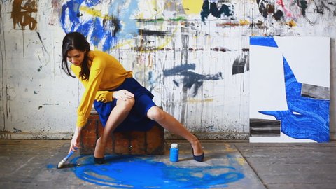 Woman painting on floor / Yekaterinburg, Ural, Russia,People