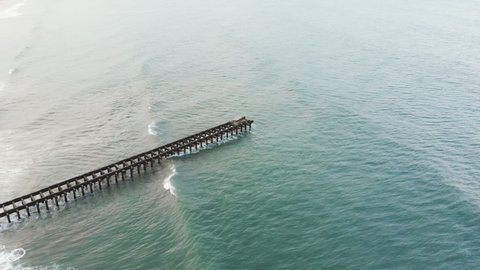 4k Drone footage of a Indian Fisherman fishing on a pier in Chennai Tamil Nadu India