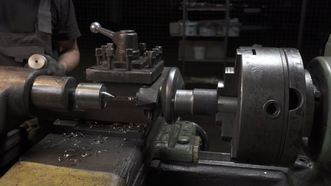 Video of working process with metal details on lathe in workplace