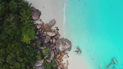 Aerial drone view on the beautiful white sand rocky beach in the seychelles, La digue silver bay