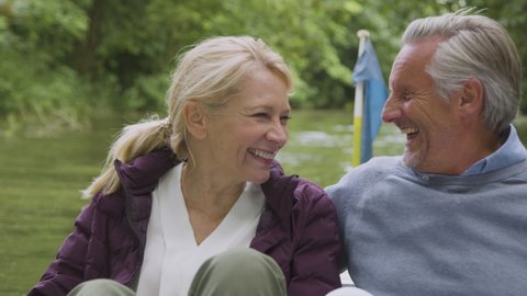 Close Up of Middle Aged Tourist Couple Enjoying Pedal Boat