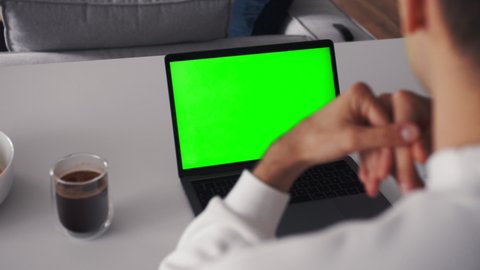 Person Using Video Conferencing technology from home for video call green screen
