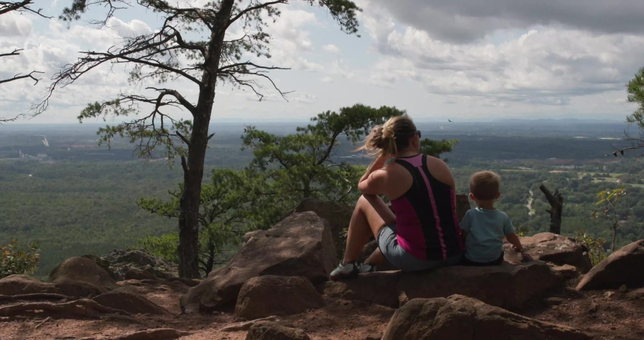 Outdoor mother with son overlooking nature