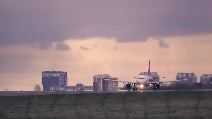 Airplane taking off at sunset. Aircraft takes off at dawn. Royalty-Free Stock Footage #1058519002