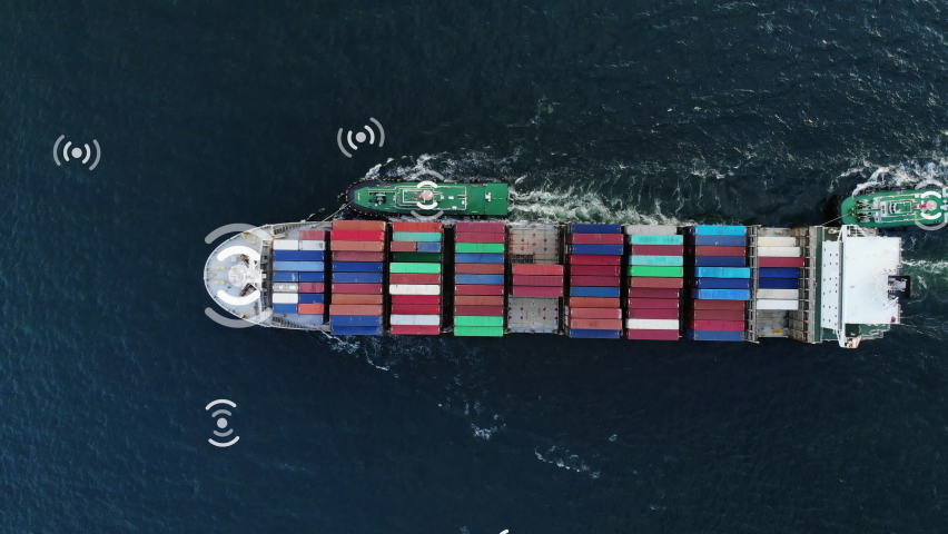 Aerial of cargo ship carrying container and running with tug boat freight shipping ship with technology WIFI wireless 5G and internet network for smart logistic transportation . | Shutterstock HD Video #1058526352