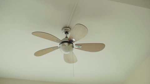 Close up fan on the ceiling electrical condition generator energy decorating machine hotel living environment global warming turning circulation slow motion