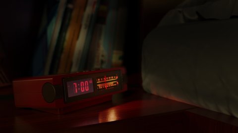Vintage alarm clock with digital dial and radio waking up at 7 AM. Close-up view. The numbers on the clock screen changes from 6:59 to 7:00 AM. Then turns on the radio receiver and its scale lights up