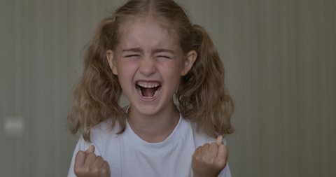 Child Shouting Loud. Portrait of Shocked, Angry and Emotional Little Girl. Young Angry Girl Yelling Screaming Slow Motion. Upset Child Scream Loudly. Adhd Attention Deficit Hyperactivity Disorder.