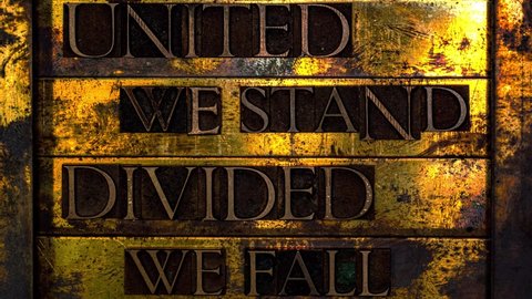 United We Stand Divided We Fall text formed with real authentic typeset letters on vintage textured grunge copper animated shattered glass texture pane and transparent background