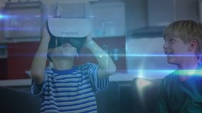 Animation of a network of connections moving over young boy wearing virtual reality headset while another boy watches and laughs. Digital interface childhood VR concept, digital composite. - Powered by Shutterstock - Get 15% off with code: PIKWIZARD15