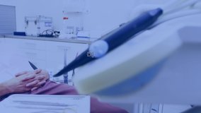 Animation of a network of connected icons moving over smiling woman wearing virtual reality headset lying back in a chair at a dentists surgery. Digital interface VR concept, digital composite. - Powered by Shutterstock - Get 15% off with code: PIKWIZARD15