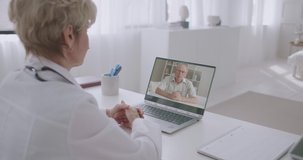 medical help online, patient is calling to hospital by video conference and talking with female doctor, distant communication
