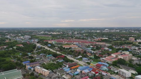 Aerial view of Cha Choeng Sao town, Chonburi near Bangkok, Thailand. Tourism city in Asia. Hotels and residential buildings with blue sky at noon.