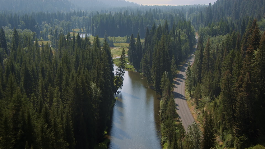 Aerials over rural Idaho lake and mountains