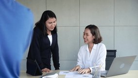 group shot of asian employees man and woman from marketing and sale department team consult together about company's profit and set the goal together to complete by stacking hands for teamwork concept - Powered by Shutterstock - Get 15% off with code: PIKWIZARD15