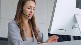 Business people wearing headset working in office to support remote customer or colleague. Call center, telemarketing, customer support agent provide service on telephone video conference call. - Powered by Shutterstock - Get 15% off with code: PIKWIZARD15