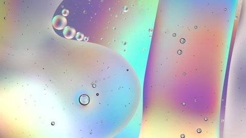Oil drops on water surface. Abstract colorful backdrop. Pastel rainbow gradient color background.